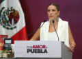 Secretaria de Turismo de Puebla aparece en evento privado en España
