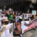 Con fotografías y consignas, familias marchan en Puebla por sus desaparecidos